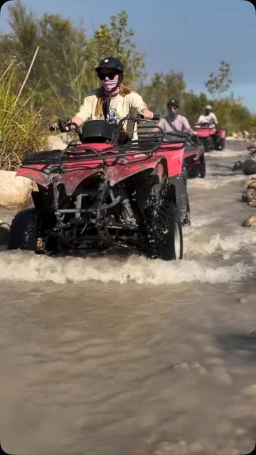 Quad riders crossing shallow water with Monster Quad Safari — partner reel preview, September 2026