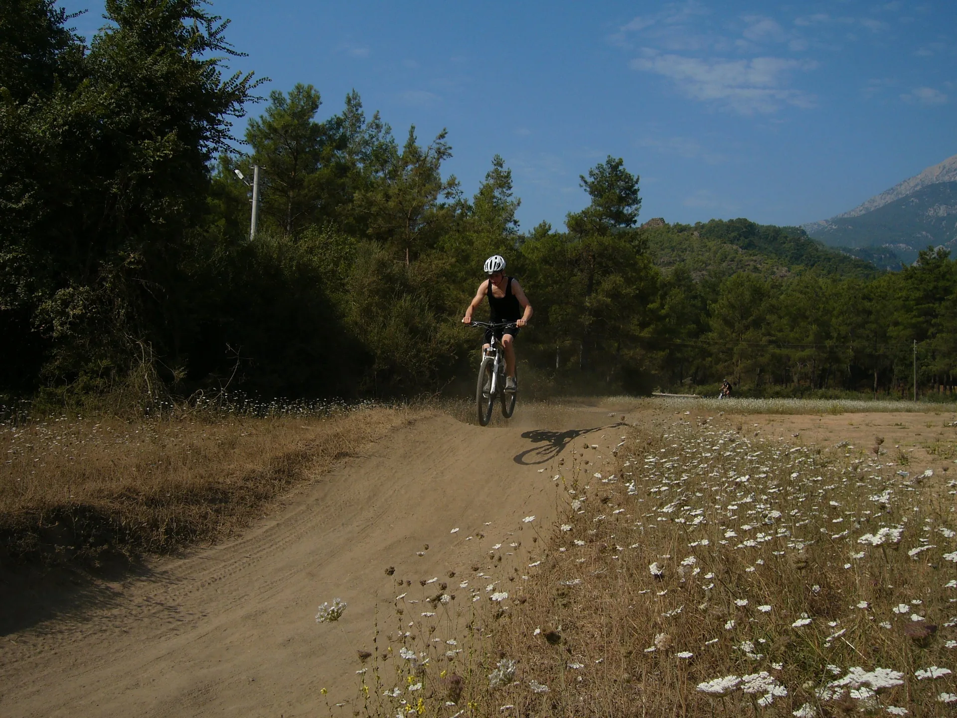Mountain biker on a narrow trail