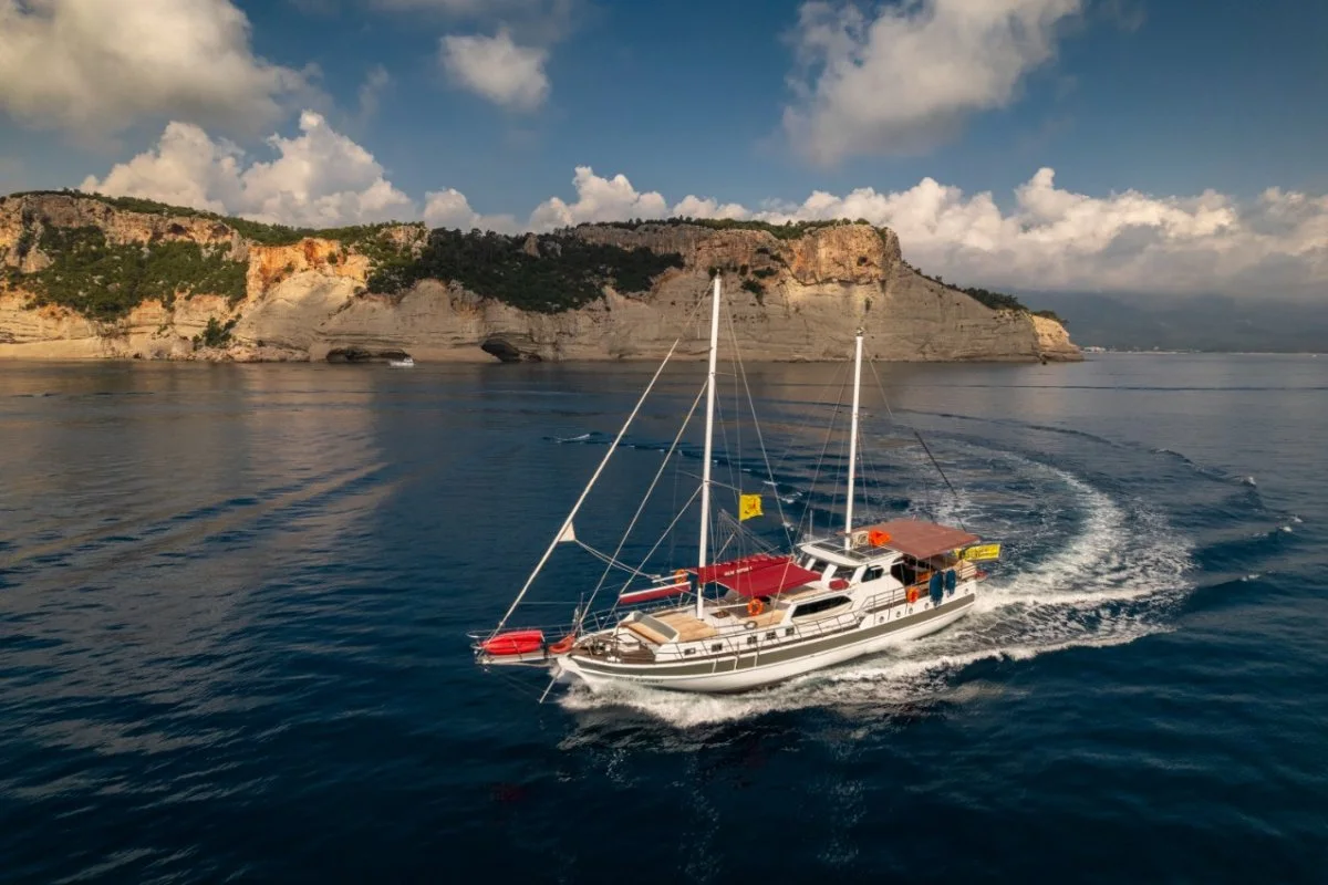 Selim Kaptan 1 beside a rocky coastline