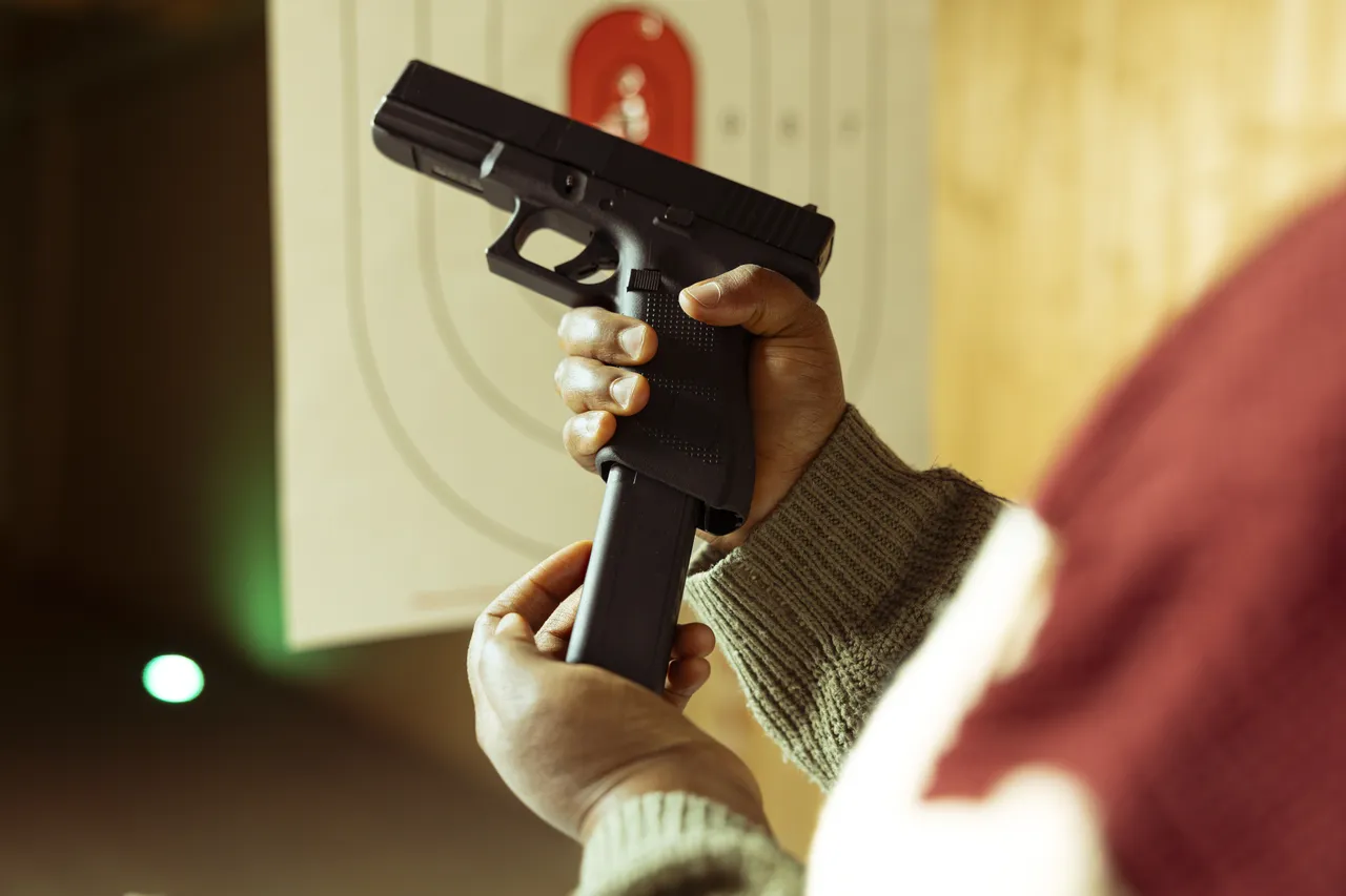 Hands holding a handgun in front of a target – illustrative shooting-sport photograph.
